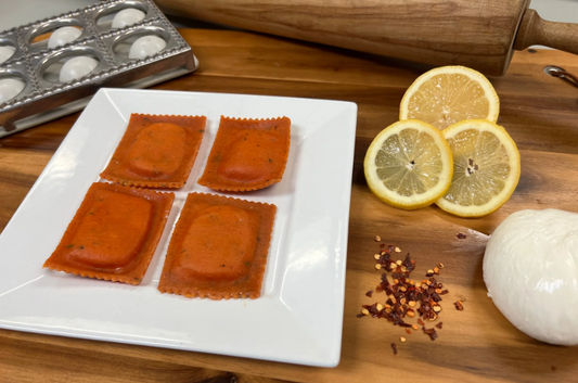 Burrata Ravioli w/ Lemon & Arugula in Tomato Basil Dough